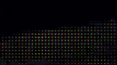 RGB multi-colored LED on the matrix of the TV close-up. Extreme macro view of 4K LED matrix red, blue, and green sub-pixels, monitor, or TV screen. Colored pixels texture creates an abstract pattern.