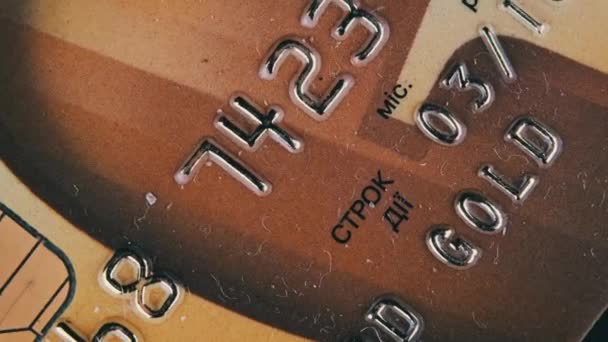 Debit Card Rotates Close Golden Credit Card Chip Numbers Plastic — Wideo stockowe