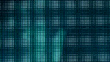 RGB multi-colored LEDs on the matrix of the TV close-up. Extreme macro view of 4K LED matrix red, blue, and green sub-pixels, monitor, or TV screen. Colored pixels texture creates an abstract pattern.