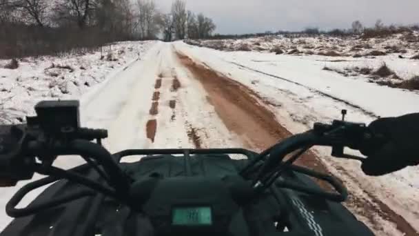 First Person View Man Riding Quad Bike Snowy Terrain Steering — Stock video