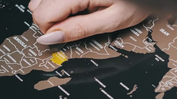 Scratching Country Tanzania Surface Scratch World Map Female Hand Erases — Stockvideo