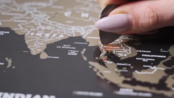 Woman Hand Erases Visited Country Thailand Travel Map Scratching Country — Video Stock
