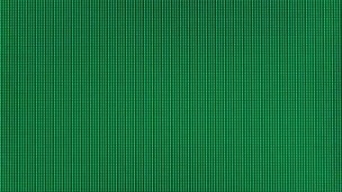 Macro view of a television LED display with RGB sub-pixels. Colored pixels in close-up create an abstract pattern. Red, blue, and green LED pixels background of VA matrix of 4K TV. Closeup monitor.