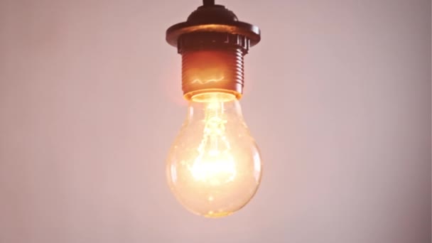 Incandescent Bulb Turns Flickers White Background Place Text Warm Flashing — Stock Video