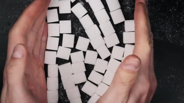 Male Hands Bend Sugar Cubes Pile Black Table Slow Motion — Stock Video