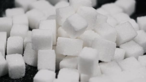 Sugar Cubes Rotate Black Background Close Many White Refined Sugar — Stock Video