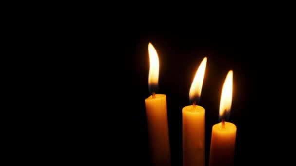 Three Candles Burning Extinguished Black Background Copy Space Candle Flames — Stock Video