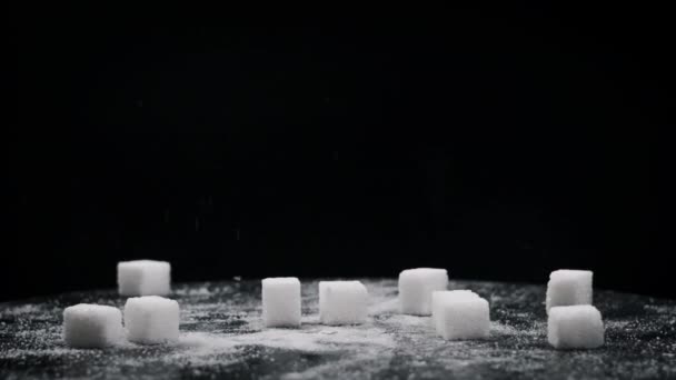 Sugar Cubes Fall Rotating Table Slow Motion Close Hard Pieces — Stock Video