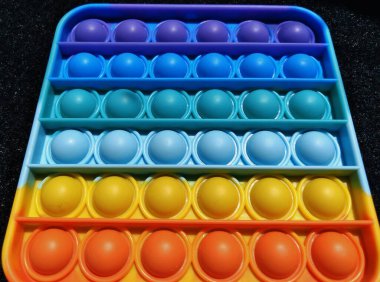 Pop it renkli oyuncak baloncuğunun soyut dokusu