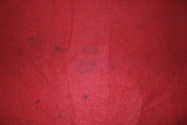 Zemindeki halının soyut dokusu kırmızı.