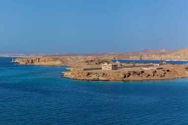 Coastline, Red Sea beaches and Sinai Mountains in the background. Travel and tourism in Egypt old city
