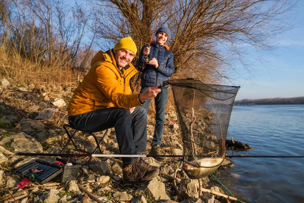 Father Son Fishing Sunny Winter Day Caught Fish Holding Landing — Φωτογραφία Αρχείου