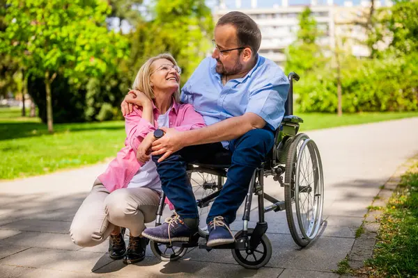 Man Wheelchair Spending Time His Friend Park Stock Image
