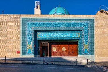 Lisbon, Portugal. 04 December 2024. Exterior view of the Lisbon Central Mosque with intricate turquoise tile design under clear blue skies. in Lisbon, Portugal clipart