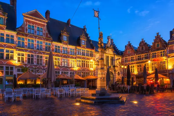 stock image Sint Veerleplein medieval square with sculpture of the Flemish lion and old fish market, Ghent, Belgium. Scenic view of historic landmarks, old city architecture at twilight, outdoor travel background