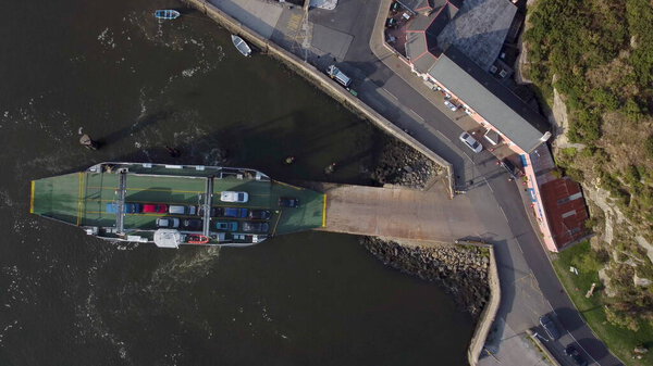 Drone River Suir, Ireland - August 2021 : Aerial view of The Passage East Ferry across River Suir linking the villages of Passage East in Co. Waterford and Ballyhack in Co. Wexford