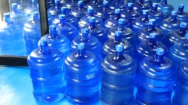 Stock file on layer bottled of water in refilling station