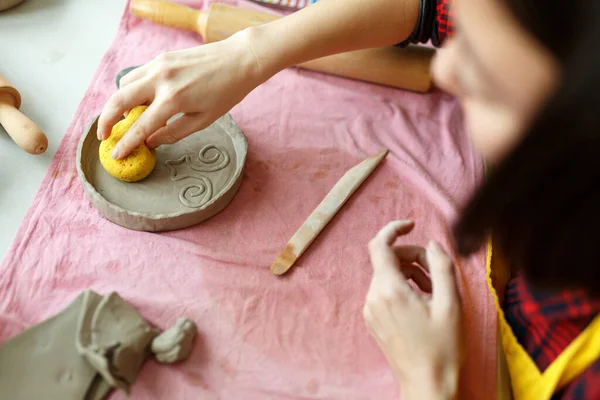 Female Hands Works with Clay Makes Future Ceramic Plate, Classes of Hand Building in Modern Pottery Workshop, Creative People Handcrafted Design.