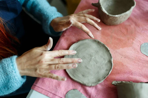 Closeup Image of Female Hands Works with Clay Makes Future Ceramic Plate, Classes of Hand Building in Modern Pottery Workshop, Creative People Handcrafted Design.