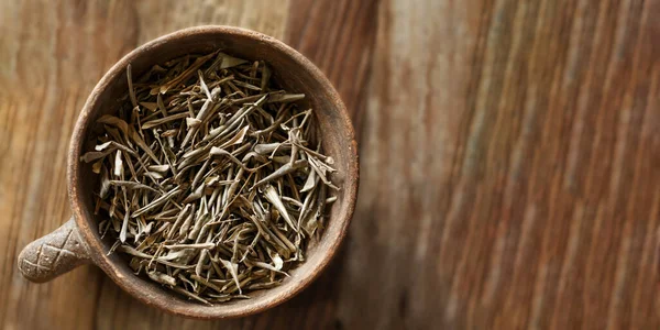 stock image Olive leaf herb used in alternative herbal medicine to benefit cardiovascular and immune systems, increases energy and promotes healthy blood pressure, on wooden background. Cyprus. Copy space