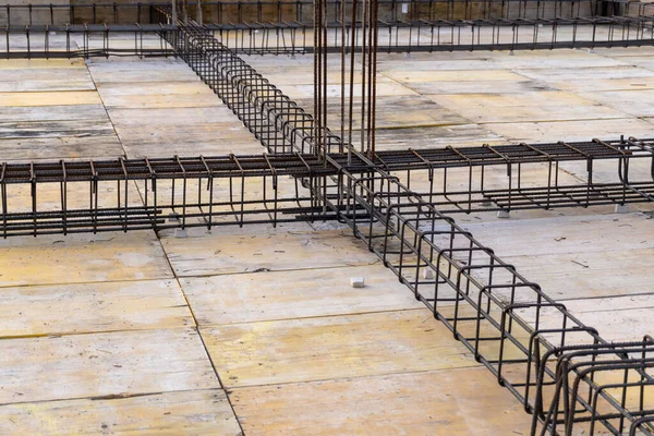 stock image Wooden boards and corrugated iron bars ready for the formwork on a construcion site