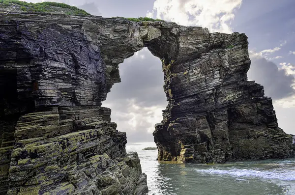 Las Catedrales beach is the tourist name for Aguas Santas beach, located in the Galician municipality of Ribadeo, on the coast of the province of Lugo, Spain, on the Cantabrian Sea.