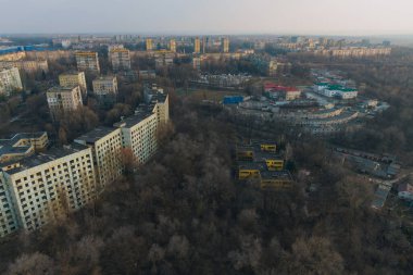 Drone view of a destroyed abandoned building from above. Abandoned city. City of ghosts. Dnepr city, Ukraine clipart