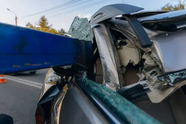 Stock image There was a collision of cars on the highway. Serious accident. Road accidents on the road. Broken windshield. The car flew under the trailer of a truck. Traffic jam. Insurance case on the road