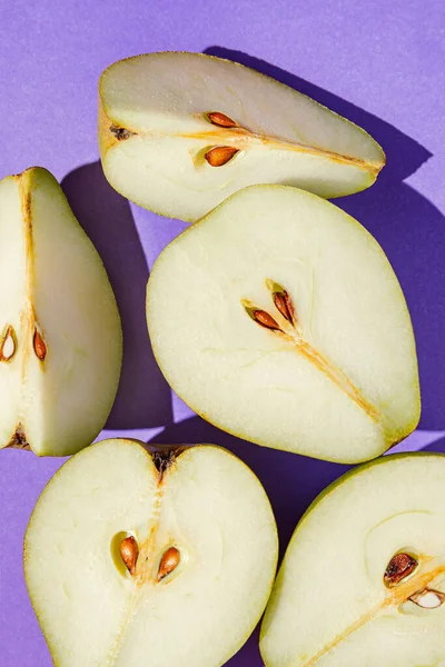 Creative layout made of raw sliced pears  closeup. Minimal style. Healthy food ingredient concept. Top view. Flat lay