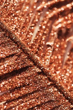 Altın bir dekoratif daldan yapılmış soyut bir kompozisyon. Parlak bir şenlik ve tatil geçmişi. Kutlama ve parti konsepti.