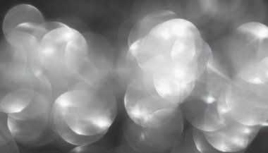 Soyut gri bokeh arkaplanı. Odaklanamayan ışıklar. Parti, tatil ve festival konsepti