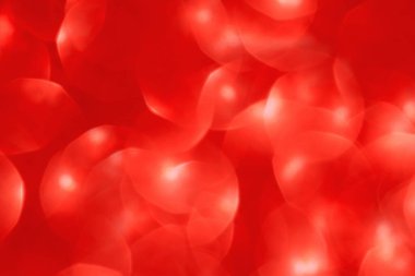 Soyut kırmızı bokeh arkaplanı. Odaklanamayan noel ışıkları. Parti, tatil ve festival konsepti