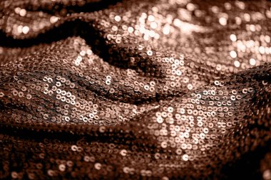 Parlak pullu kumaşın soyut bileşimi. Tatil ve parti konsepti. 2025 yılının rengi