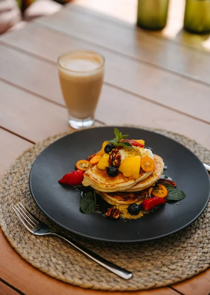 Pancakes Topped Fruits Nuts Served Latte Wooden Table — Stock Photo, Image
