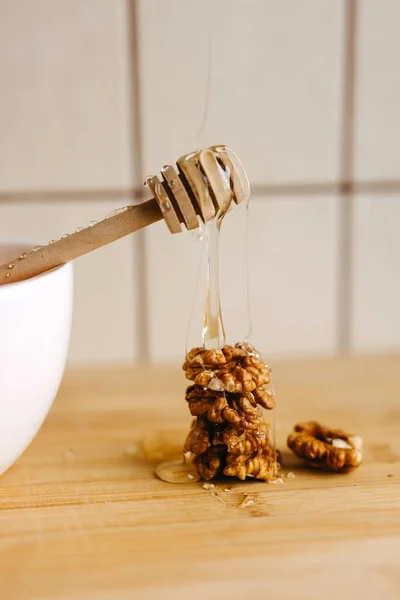 Golden Honey Drizzling Walnut Stack Dipper Royalty Free Stock Images