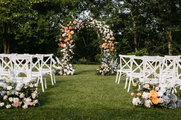 Outdoor Wedding Setup Floral Arch Wedding Aisle White Wooden Chairs Royalty Free Stock Images