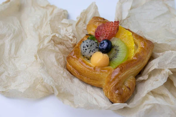 Mixed Fruit Danish Wrapped Brown Paper White Background — Stockfoto