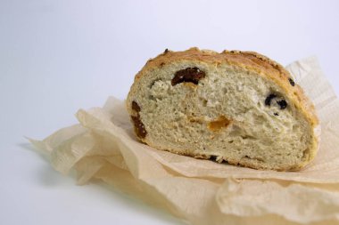 Delicious Mediterranean diet, Wheat Bread bedded with brown paper on White Background