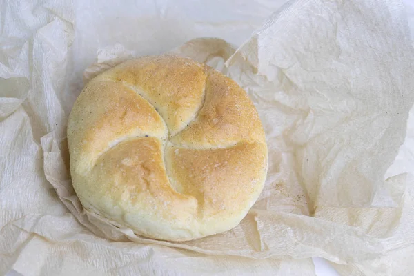 Kaiser Roll, Tasty bread Roll Wrapped with Brown paper on white background