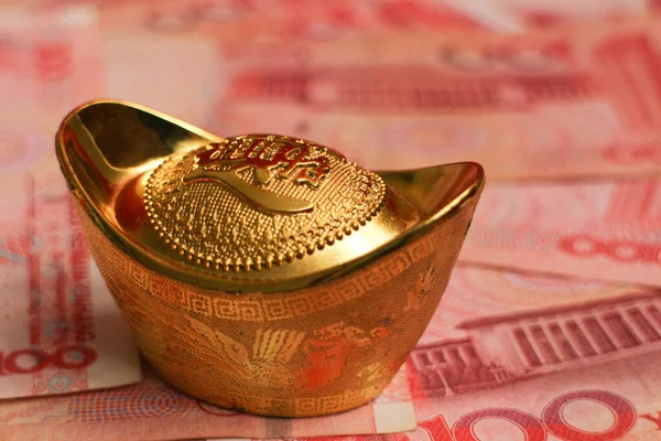 Chinese Ingots on Chinese Money Background for New Year Decoration