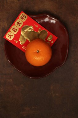 Orange and the Lucky Red Envelope with the Script in Chinese, Good Luck and Rabbit in Gold printed