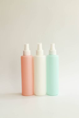 Close up Container for liquid , white, punk and blue bottle