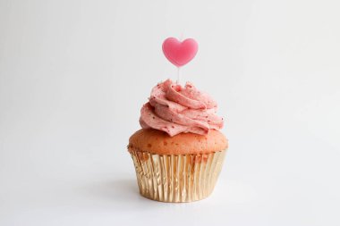 Strawberry Cup cake topped with a Pink Candle to Celebrate Valentine's Day , White Background