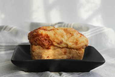 Tasty Ham and Cheese Bread on Grey Napkin