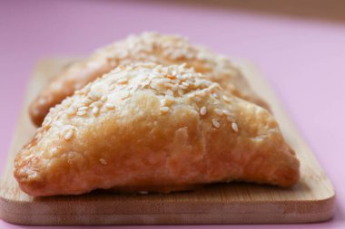 Tasty snack, Apply Puff on Pink Background