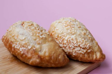 Tasty snack, Apply Puff on Pink Background