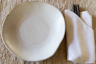 Earth tone mood for table set, white Ceramic plate, earth tone color linen napkin