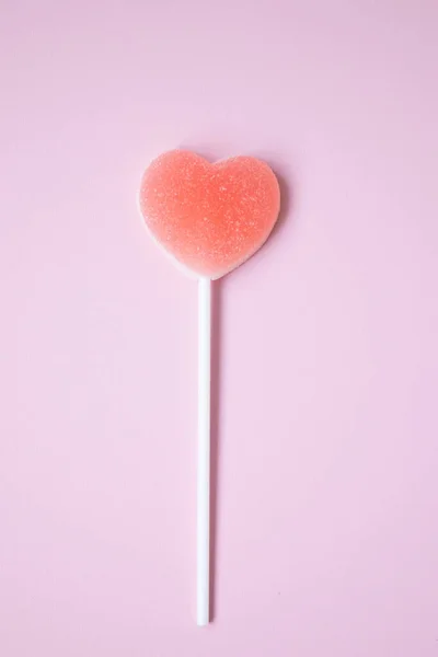 Pink Jelly coated with icing on Pink Background for Valentine\'s day