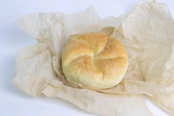 Kaiser Roll Tasty Bread Roll Wrapped Brown Paper White Background — Stock Fotó