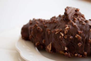 Tasty Dessert, Chocolate Croissant on White Background 'ı kapatın.